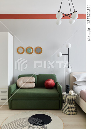 Contemporary Modern Living Room featuring a Green Sofa paired with Stylish Decor Elements 127821844