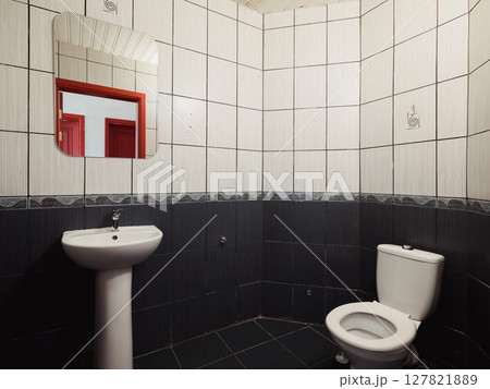 This bathroom features a simple modern design with contemporary fixtures in neutral colors This bathroom features a simple modern design with contemporary fixtures in neutral colors 127821889