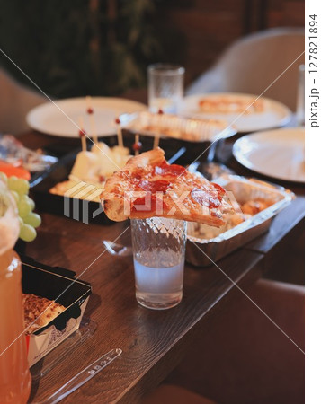 A Delicious and Colorful Spread of Appetizers and Refreshing Beverages on a Table 127821894