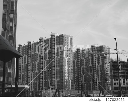 Modern Urban Apartment Buildings Currently Under Construction in the City Landscape Modern Urban Apartment Buildings Currently Under Construction in the City Landscape 127822053