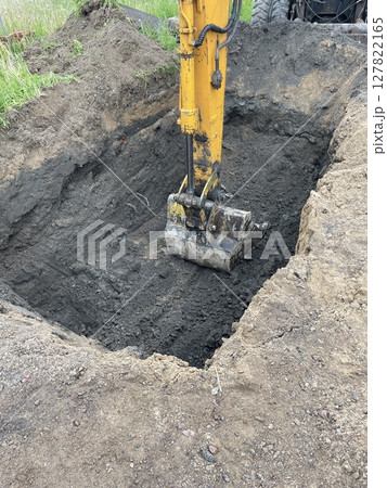 Excavation Work is currently in Progress Heavy Machinery Operating at the Construction Site Excavation Work is currently in Progress Heavy Machinery Operating at the Construction Site 127822165