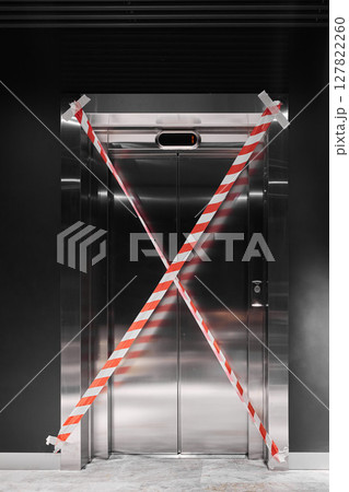 The elevator is currently out of service and is marked with barrier tape for safety reasons The elevator is currently out of service and is marked with barrier tape for safety reasons 127822260
