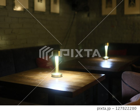 Experience a Cozy Ambiance within a Modern Cafe Enhanced by Elegant and Inviting Lighting Experience a Cozy Ambiance within a Modern Cafe Enhanced by Elegant and Inviting Lighting 127822280