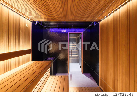 Discover a Modern Sauna Interior with Sleek Wood Design and Soothing Ambient Lighting Discover a Modern Sauna Interior with Sleek Wood Design and Soothing Ambient Lighting 127822343