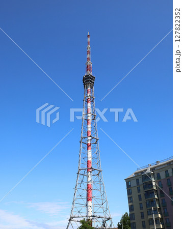 A telecommunication tower stands tall against a clear, bright blue sky, unimpeded by clouds A telecommunication tower stands tall against a clear, bright blue sky, unimpeded by clouds 127822352