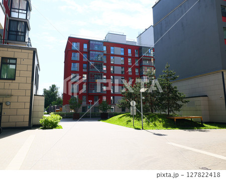 A thoughtfully designed urban residential area with green spaces for community engagement 127822418