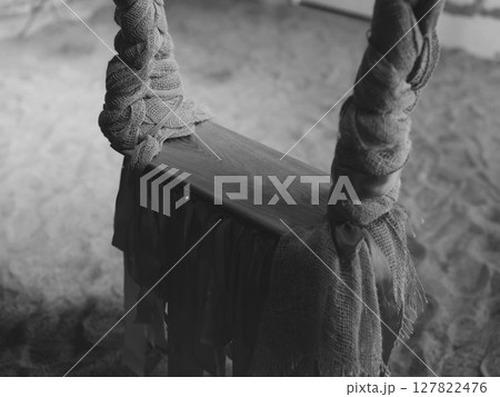 A lonely swing set in an abandoned playground, evoking nostalgia and desolation 127822476