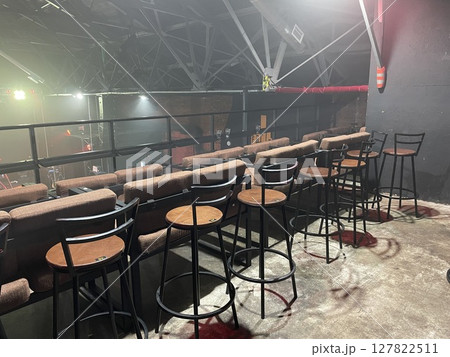 This stylish bar area features high stools combined with ambient lighting for a cozy atmosphere This stylish bar area features high stools combined with ambient lighting for a cozy atmosphere 127822511