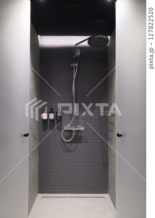 Experience a Modern Minimalist Shower integrated into a sleek bathroom design of elegance 127822520