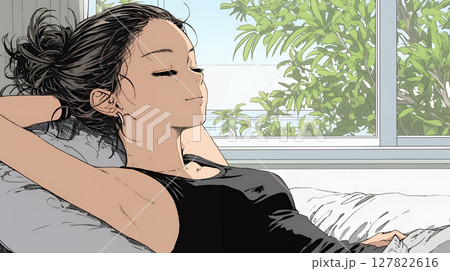 のんびり・ゆったり：朝日を浴びベッドで寛いでいる若い女性