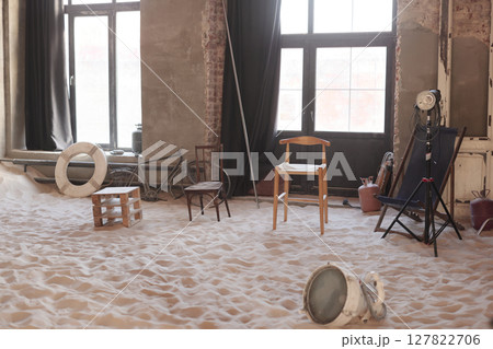 An Artistic Space Featuring Chairs on a Sandy Floor with inspiring Minimalist Design Elements An Artistic Space Featuring Chairs on a Sandy Floor with inspiring Minimalist Design Elements 127822706