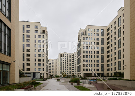 A Modern Urban Apartment Complex featuring a striking Contemporary Architectural design style A Modern Urban Apartment Complex featuring a striking Contemporary Architectural design style 127822870