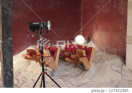A beautifully designed artistic indoor setup featuring sand, striking lighting, and ambiance A beautifully designed artistic indoor setup featuring sand, striking lighting, and ambiance 127822985