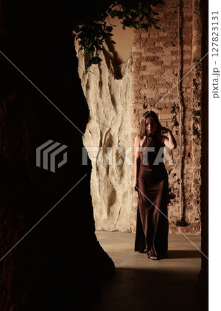 An Elegant Woman Gracefully Posing in a Captivating and Artistic Setting with Style 127823131