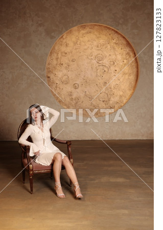 A Surrealistic Portrait featuring a Moon and a Graceful Elegant Female Model in a captivating scene 127823133