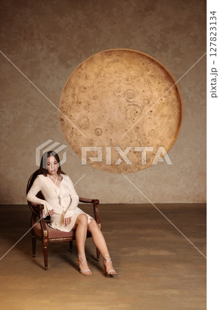 An Elegant Woman Posing Gracefully in a Modern Artistic Setting with Creative Expression 127823134