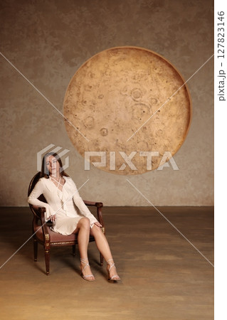 Captivating and Enchanting Portrait of a Woman Surrounded by an Artistic Moonlit Background Captivating and Enchanting Portrait of a Woman Surrounded by an Artistic Moonlit Background 127823146