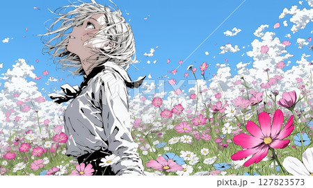 コスモス畑にいる若い女性