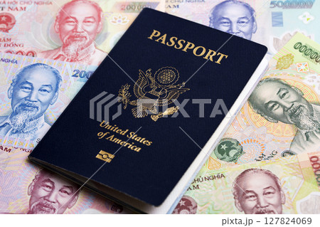 American passport on Vietnamese Dong American passport on Vietnamese Dong 127824069