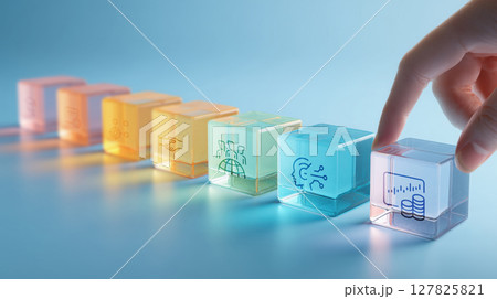 Translucent glass blocks with icons representing project management concepts are arranged in row on blue background 127825821
