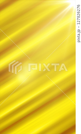Bright abstract yellow background with diagonal glowing light rays and radiant sun flare in the corner 127826276