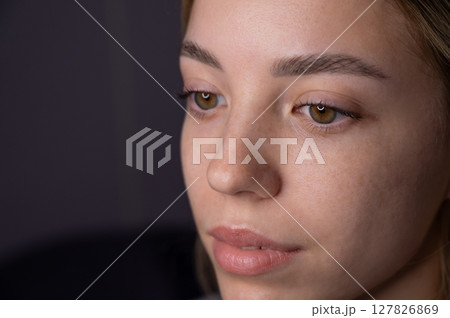 Close-up portrait of a woman after eyelash lamination procedure.  127826869