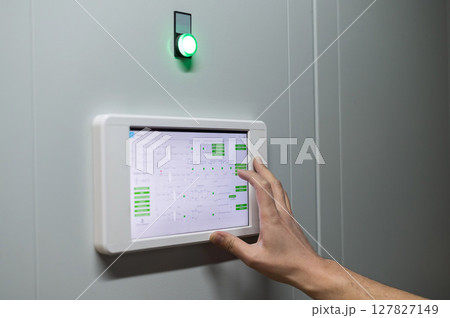 Modern Control System Interface with Green Indicator Light.  127827149
