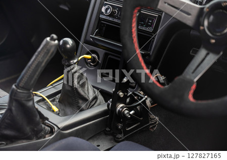 Detailed Close-Up of a Sports Car Gear Shift and Interior Features.  127827165