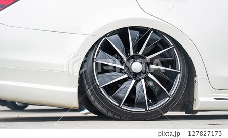 Close-Up of Custom Car Wheel and Tire Excellence. Close-Up of Custom Car Wheel and Tire Excellence. 127827173