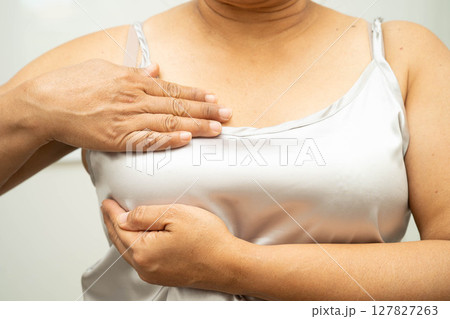 Asian woman self touching check lump or Breast cancer, Breast Self Exam. Asian woman self touching check lump or Breast cancer, Breast Self Exam. 127827263