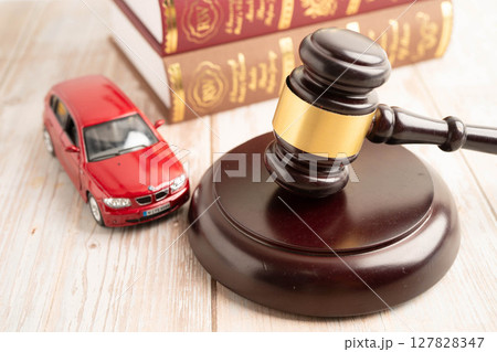 Bangkok, Thailand March 15, 2024 Car accident lawsuit and insurance, Judge hammer and money with car model. 127828347