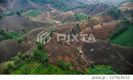 Aerial view of a mountain that has been cut down and destroyed by humans. Bird's-eye view of deforestation in Thailand. Environmental destruction. 127829232