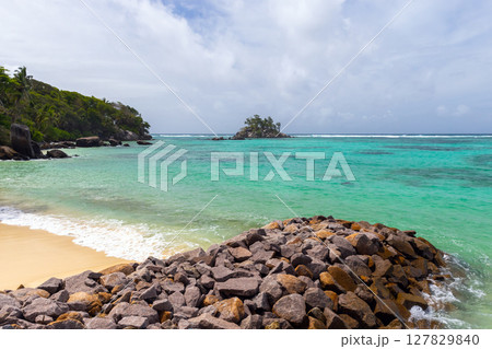 Mahe island, Seychelles. A picturesque tropical island with lush greenery Mahe island, Seychelles. A picturesque tropical island with lush greenery 127829840