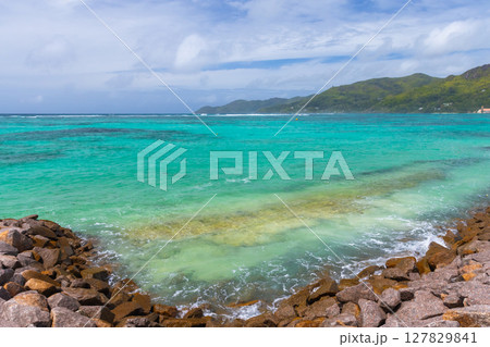 Mahe island, Seychelles. Scenic ocean view showcasing crystal clear waters Mahe island, Seychelles. Scenic ocean view showcasing crystal clear waters 127829841