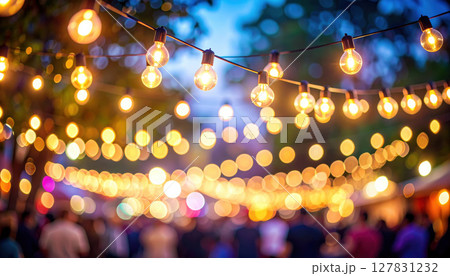 Colorful bokeh and retro string lights create festive atmosphere Colorful bokeh and retro string lights create festive atmosphere 127831232