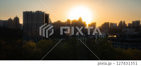 City Skyline at Sunset with Golden Sunlight Silhouette City Skyline at Sunset with Golden Sunlight Silhouette 127831351