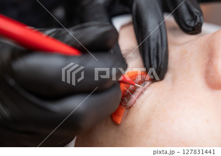 Caucasian woman undergoing eyelash lamination procedure. Caucasian woman undergoing eyelash lamination procedure. 127831441