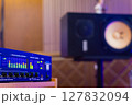 LED VU meter, audio meterbridge on loudspeaker monitor background in recording studio. music production, recording concept 127832094