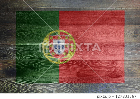 Portugal flag on rustic old wood surface background 127833567
