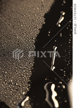 black wet surface covered with a large number of water droplets black surface, close up black wet surface covered with a large number of water droplets black surface, close up 127834816