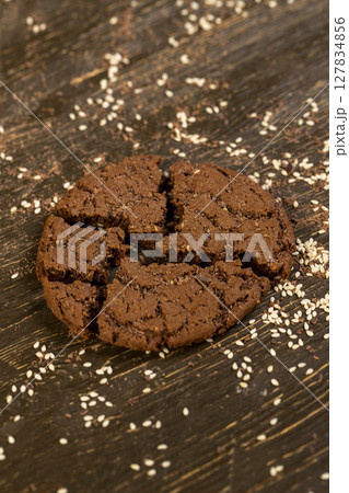sweet chocolate biscuits on the kitchen , chocolate biscuits with real cocoa and sesame seeds. close up sweet chocolate biscuits on the kitchen , chocolate biscuits with real cocoa and sesame seeds. close up 127834856
