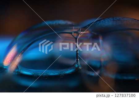 Blue liquid surface on black background, oil stains movement, bright chemistry, surreal background, blue sky colour, connection lines 127837100