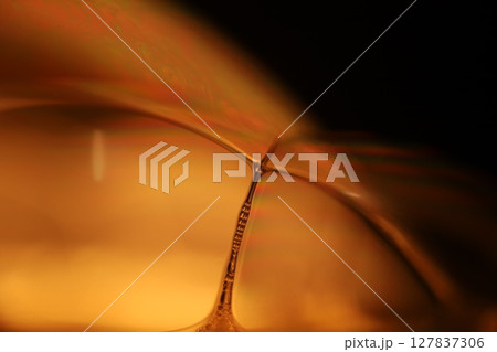 Oil production, brown bubbles in macro, texture of viscous black liquid, oil in laboratory 127837306