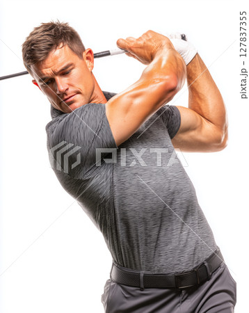 Muscular golfer showcasing perfect swing technique on the green 127837355