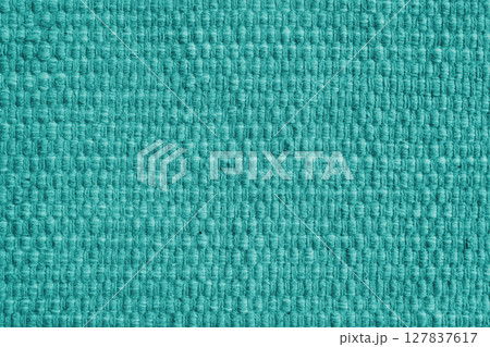 Texture of turquoise natural fabric with large weaving. Upholstery, cloth background 127837617