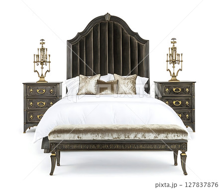 A bed with a black headboard and a white comforter 127837876