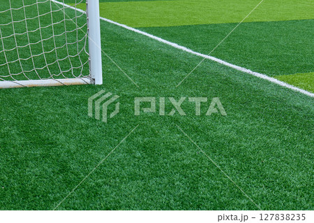 Soccer goalpost on artificial grass field 127838235