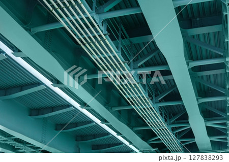 view from below of the bridge supporting beams, close up of steel structure view from below of the bridge supporting beams, close up of steel structure 127838293