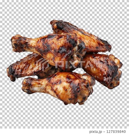 Juicy grilled chicken drumsticks with glossy, caramelized glaze are stacked together, showcasing deliciously charred and savory appearance. Perfect for barbecue feast 127839840