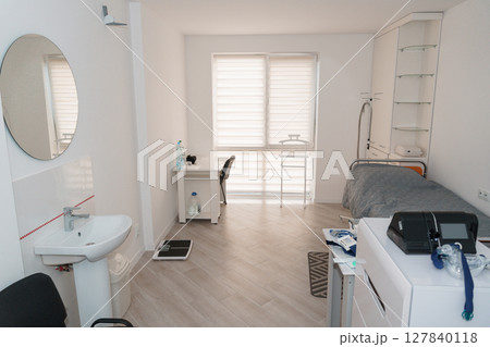 Polysomnography Room Setup: Modern Sleep Study Clinic Interior with Monitoring Equipment, Sink, and Bed, Light Wood Tone Aesthetic Polysomnography Room Setup: Modern Sleep Study Clinic Interior with Monitoring Equipment, Sink, and Bed, Light Wood Tone Aesthetic 127840118